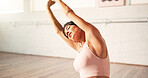 Yoga, woman and stretching arms for fitness, holistic exercise and wellness in studio. Yogi, mature person and body bend in club for pilates, meditation and improve flexibility with muscle workout
