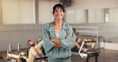 Buy stock photo Portrait, woman and personal trainer with arms crossed for pilates, fitness and session. Happy, female person and confident for exercise course, training support and join us for wellness membership
