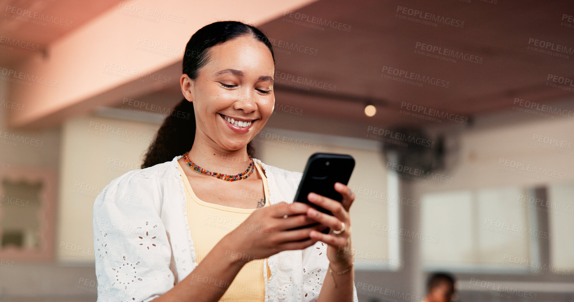 Buy stock photo Smile, smartphone and woman in studio, fitness and typing with digital app to track progress. Happy, mobile user and healthy person in wellness center, cellphone and social media with communication