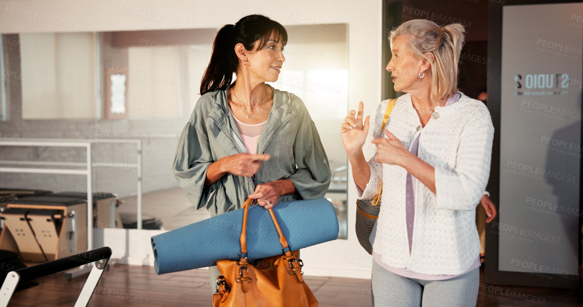 Buy stock photo Women, fitness and discussion with equipment for workout preparation, training or pilates class. Female people, friends or conversation with gear, chat or advice for gym tips, health or wellness
