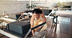 Safety, inspection and woman with reformer, gym and adjust springs for workout resistance or fitness. Health club, pilates instructor and person with equipment, maintenance and setup for exercise