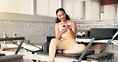 Buy stock photo Happy, smartphone and woman in studio, fitness and typing with online reading, app and internet. Smile, mobile user and healthy person in wellness center, cellphone and communication with email