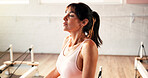 Breathing, relax and woman on reformer machine in studio for cool down exercise for wellness. Peace, equipment and calm female person with recovery on break for pilates class workout in health gym.