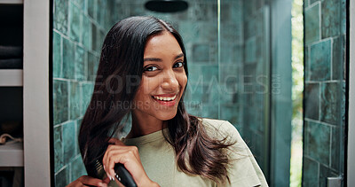 Buy stock photo Beauty, brushing hair and portrait of woman in bathroom of home for getting ready or morning routine. Hairbrush, mirror and smile of happy Indian person in apartment for daily haircare treatment