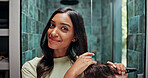 Beauty, hairbrush and portrait of woman in bathroom of home for getting ready or morning routine. Brushing hair, mirror and smile of happy Indian person in apartment for daily haircare treatment