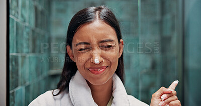 Buy stock photo Face cream, goofy and woman in bathroom with skincare, natural or moisturizer for wellness. Playful, facial lotion and female person with dermatology routine in morning for hygiene in apartment.