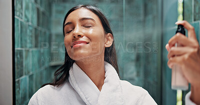 Buy stock photo Woman, skincare and spray with face mist in bathroom for hydration, dermatology or beauty cosmetic. Female person, and wellness in home with facial product, glowing skin and hyaluronic acid benefits.