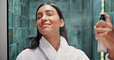 Buy stock photo Woman, skincare or apply with face mist in bathroom for hydration, dermatology or beauty cosmetic. Female person, or spray bottle in home with facial product, glowing skin or hyaluronic acid benefits