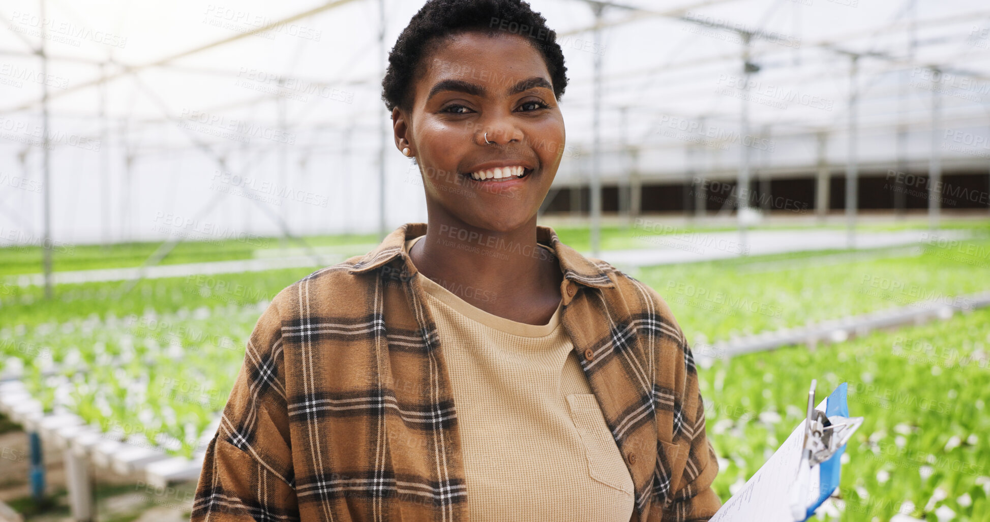 Buy stock photo Happy, black woman and portrait with greenhouse for agriculture, plant production or natural growth. Female person, farmer or smile with clipboard for organic food, farming crops or sustainability