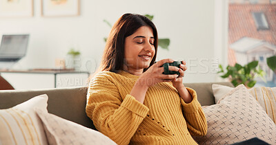 Buy stock photo Calm, relax or Indian woman on sofa with coffee cup, satisfied or reflection in morning routine. Smile, aroma or female person in house with mug, mood improvement or mindfulness at start of day.
