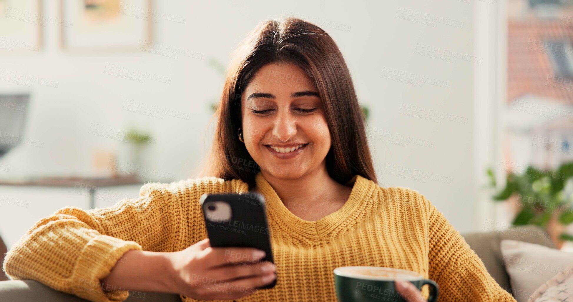 Buy stock photo Woman, phone and happy with coffee on sofa, texting and contact for online dating with chat in home. Person, smartphone and smile with cup, drink and mobile app for social network on couch at house