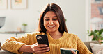 Woman, phone and happy with coffee on sofa, texting and contact for online dating with chat in home. Person, smartphone and smile with cup, drink and mobile app for social network on couch at house