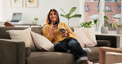 Buy stock photo Woman, phone and thinking with coffee on couch, texting or smile with online dating chat in home. Person, smartphone and decision with cup, relax and mobile app for social media on sofa at apartment