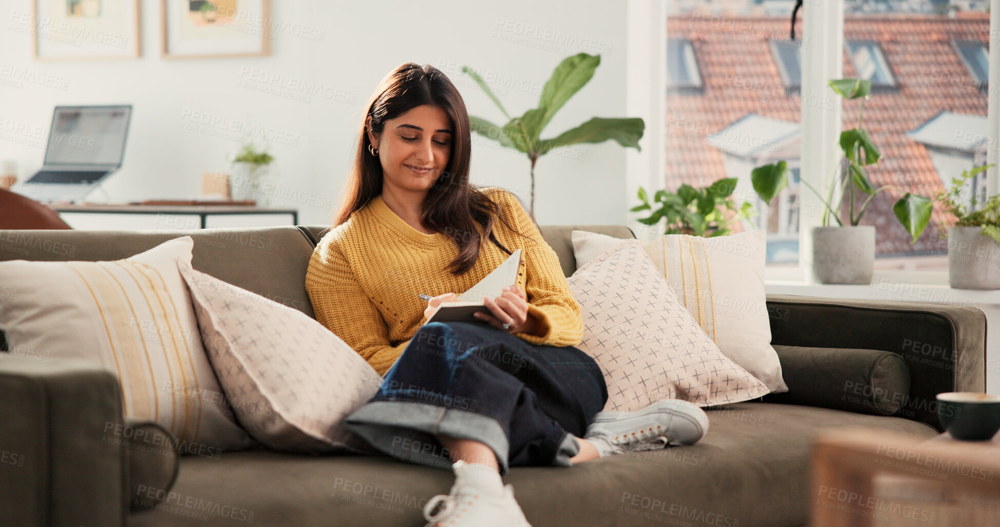 Buy stock photo Woman, smile and writing in diary on sofa, relax and daydream with inspiration in living room at house. Person, notebook and reflection on couch for perspective, insight and memory at apartment