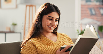 Buy stock photo Coffee, reading book and woman in home for story, fantasy and morning beverage. Tea, literature and happy person on sofa in living room with drink, fiction and hobby for relax on weekend break
