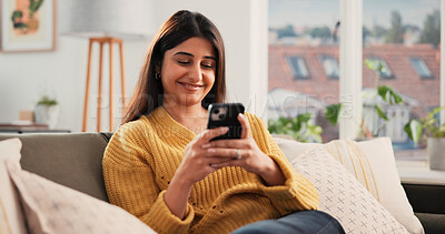 Buy stock photo Smartphone, smile and woman in home for relax, reading ebook or blog on website. Mobile, happy and person on sofa in living room for online communication, news notification or check internet forum