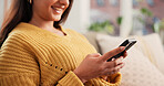 Phone, hands and woman on sofa in home with networking, communication or social media on mobile app. Typing, relax and female person with cellphone for texting, contact or chatting in living room.