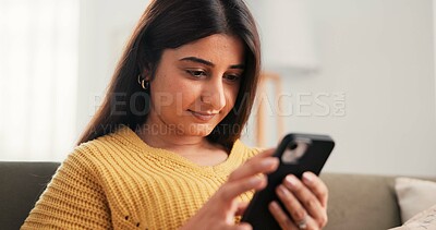 Buy stock photo Phone, reading and woman on sofa in home with networking, communication or social media on mobile app. Smile, relax and female person with cellphone for texting, contact or chatting in living room.