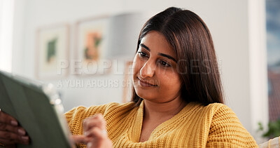 Buy stock photo Creative, woman and reading with tablet at house for proofreading, draft update and latest news. Female person, remote work and digital for research, editor feedback and publication of story headline
