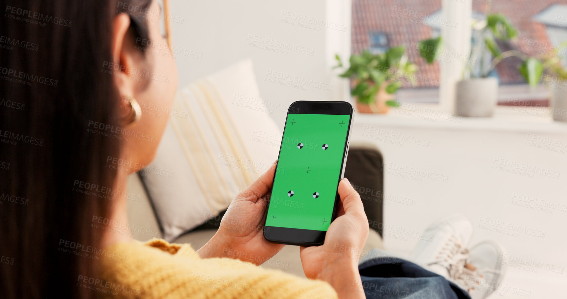 Buy stock photo Woman, hands or phone with green screen in home for advertising, research or marketing app. Back view, female person or user with mobile smartphone display for online entertainment on mockup space