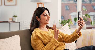Buy stock photo Phone, video call and woman on sofa in house with communication, greeting and online conversation. Happy, waving and female person with cellphone for virtual discussion with networking in living room