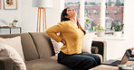 Back pain, stretching or Indian woman in house with laptop, overwhelmed or spine injury in remote work. Bad posture, WFH or freelancer on sofa with ache, muscle stretch or strain in task management.
