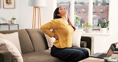 Buy stock photo Back pain, stretching or Indian woman in house with laptop, overwhelmed or spine injury in remote work. Bad posture, WFH or freelancer on sofa with ache, muscle stretch or strain in task management.