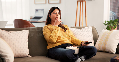 Buy stock photo Eating, popcorn and woman with remote, home and watching tv with app subscription and entertainment. Indian person, relax and streaming movies on website, online and chilling with snack on couch