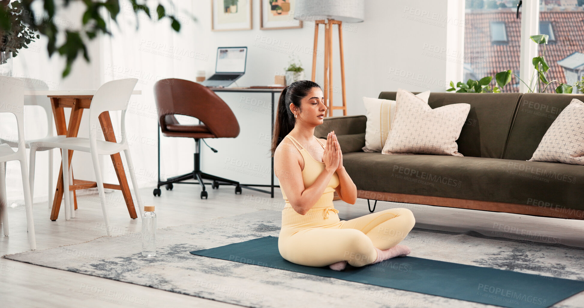 Buy stock photo Yoga, meditation and house with woman, hands together and inner peace with wellness, chakra or zen. Apartment, yogi or healthy person on floor, calm or stress relief with routine or pilates in lounge
