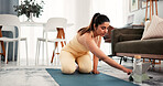 Fitness, yoga mat and woman typing with tablet, search warm up routine or online pilates tutorial. Digital class, live stream and person browsing with tech for exercise video, lounge and home workout