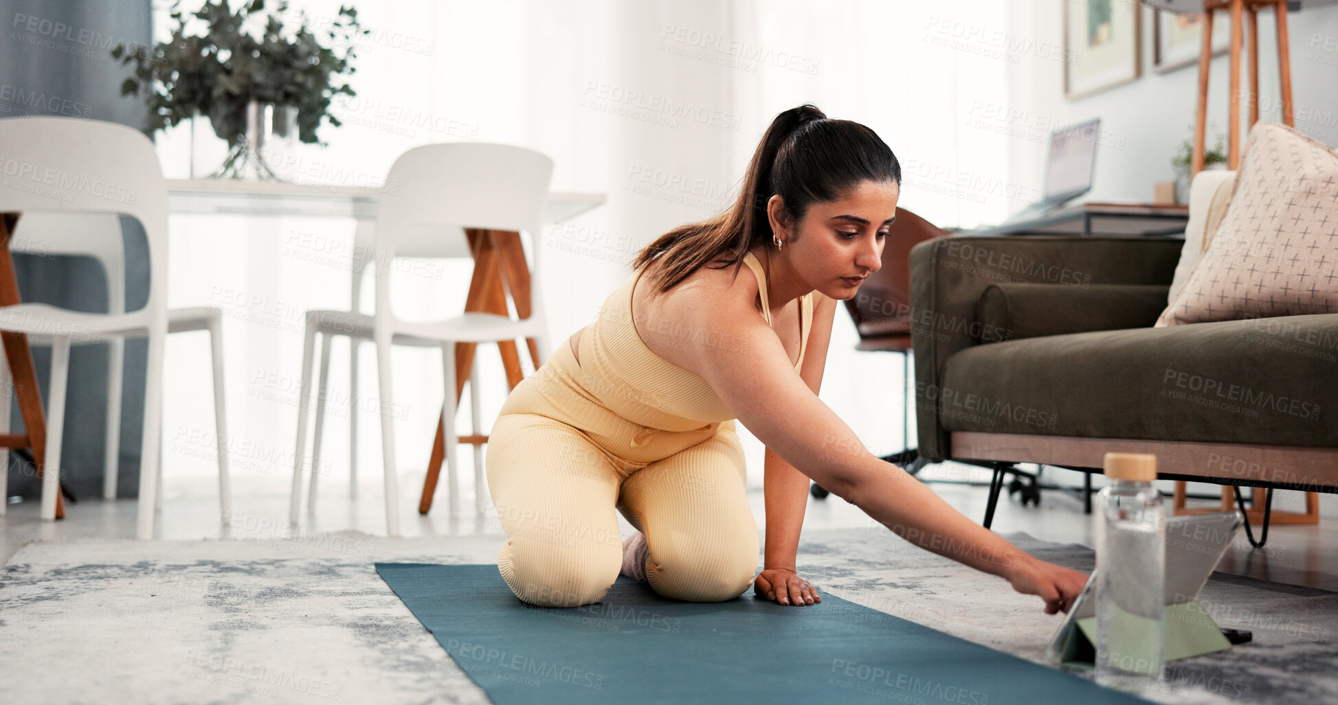 Buy stock photo Fitness, yoga mat and woman typing with tablet, search warm up routine or online pilates tutorial. Digital class, live stream and person browsing with tech for exercise video, lounge and home workout