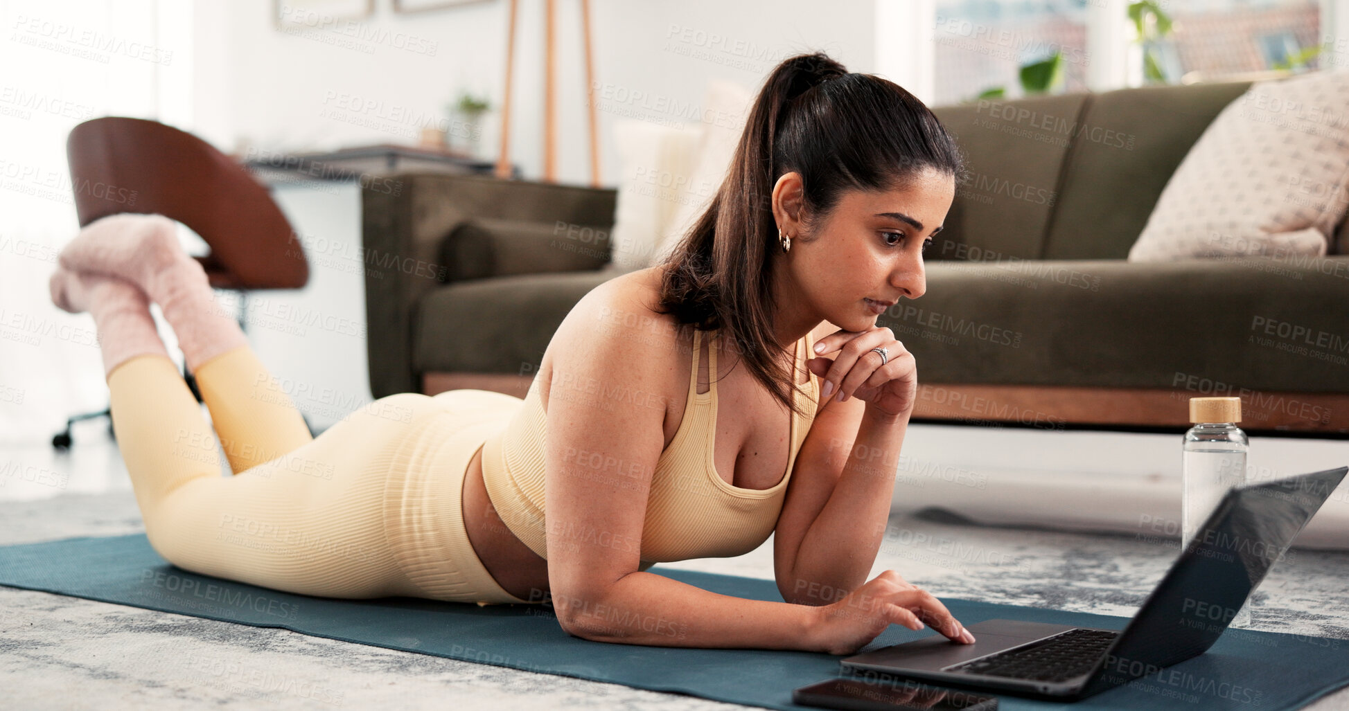Buy stock photo Fitness, home and woman search with laptop, warm up routine or online pilates tutorial. Digital class, live stream and person browsing with technology for exercise video, lounge and yoga mat