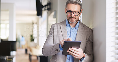 Buy stock photo Planning, scrolling and tablet with business man in coworking office for browsing or research. App, glasses and internet with mature employee person in workplace for feedback or information review