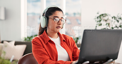 Buy stock photo Woman, laptop and headphones with remote work from home, review or typing with project in lounge. Person, freelance writer and computer for proposal, editing or creative insight with glasses at house