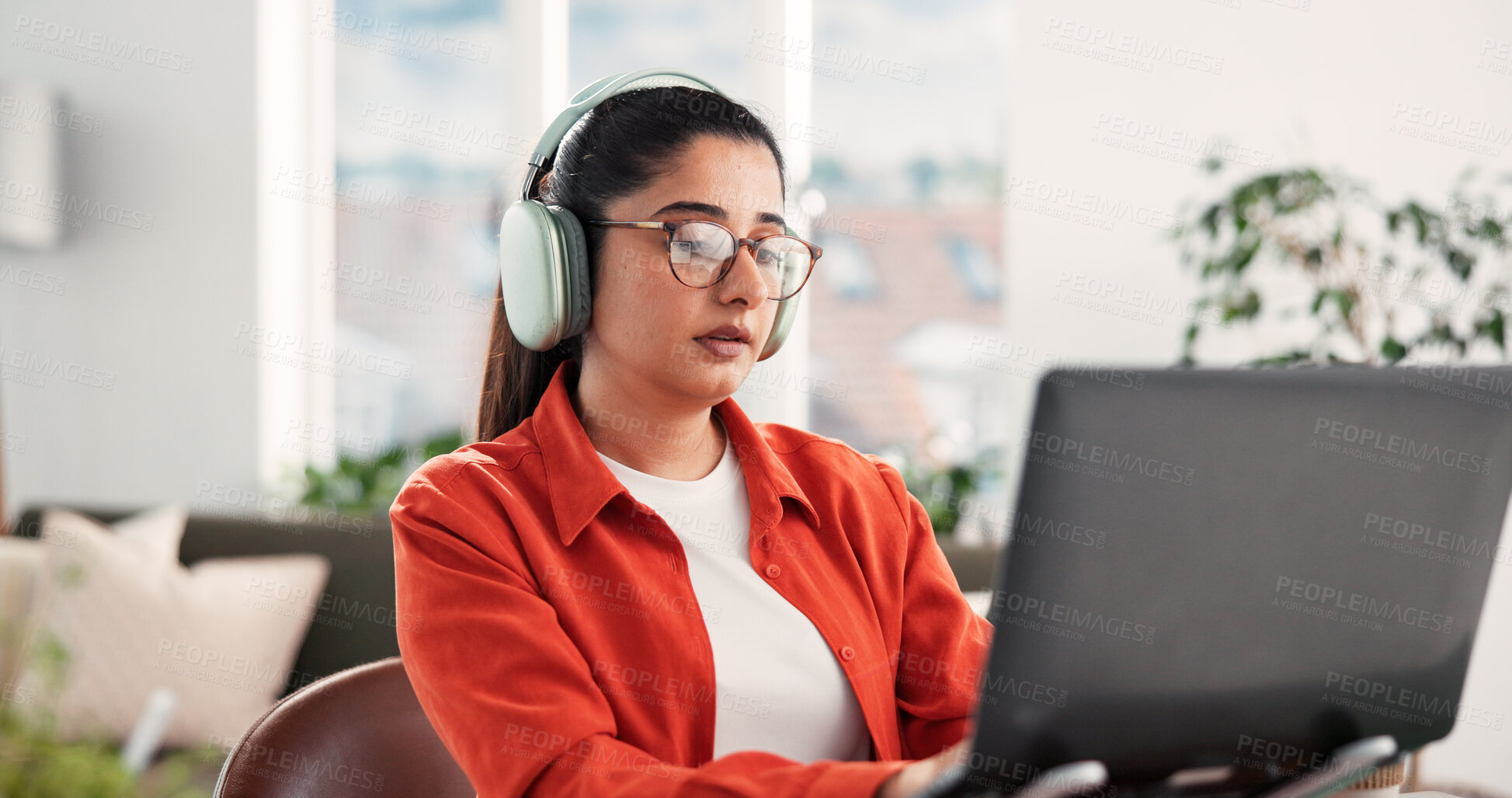 Buy stock photo Woman, laptop and headphones with remote work from home, review or typing with project in lounge. Person, freelance writer and computer for proposal, editing or creative insight with glasses at house