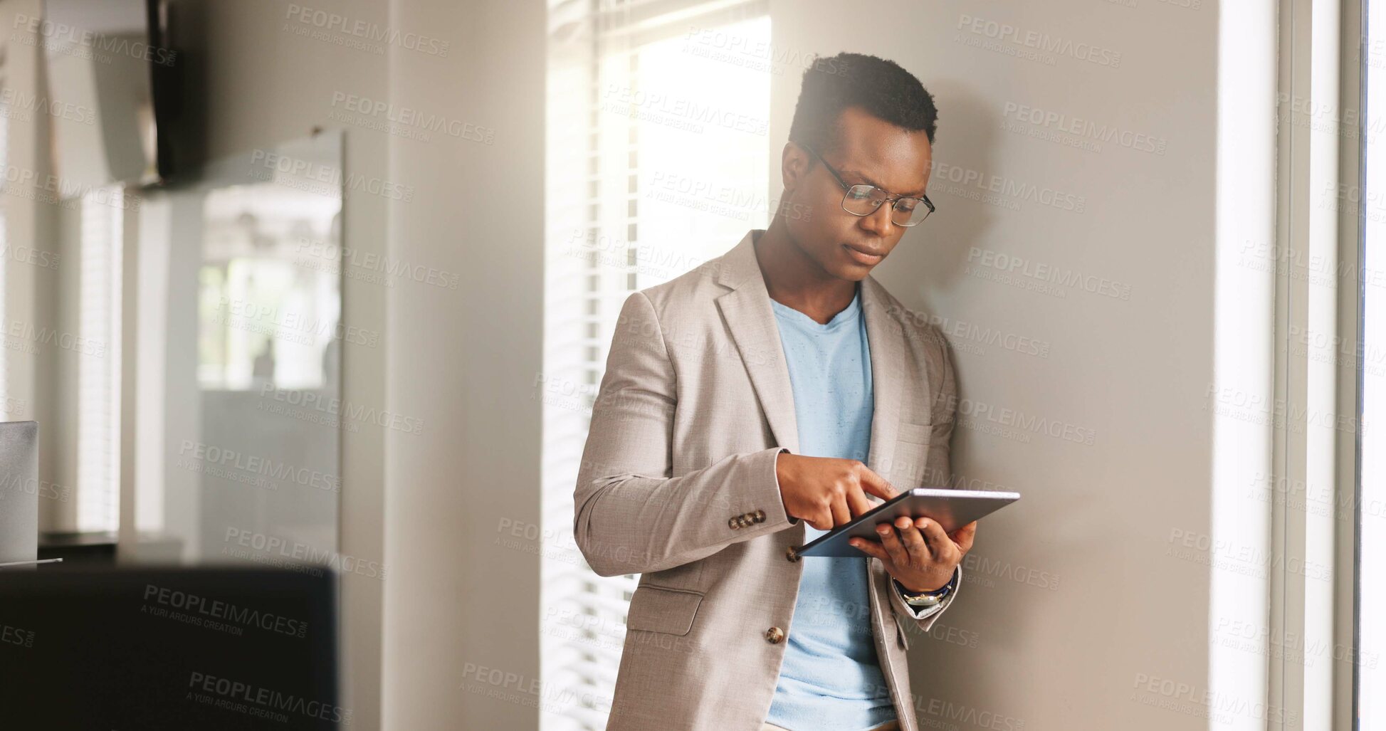 Buy stock photo Media agency, tablet and black man in office, typing and copywriting with online reading. Person, connection or journalist with tech, magazine website or email for submission, internet or publication