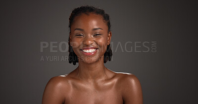 Buy stock photo Skincare, glow and woman with smile, portrait and natural cosmetics for healthy skin or mockup space. Gray background, happy black person and shine with dermatology, self care and studio in Nigeria