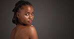 Space, skincare and portrait of black woman in studio for grooming, self care and dermatology. Mockup, dark background and person with natural beauty, wellness and aesthetic for glow, shine or health