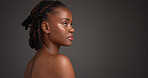 Body care, serious and black woman in studio with space for natural, wellness and soft skin. Beauty, cosmetic and African person with dermatology for glow, hydration or collagen by gray background.