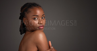 Buy stock photo Space, beauty and portrait of black woman in studio for grooming, self care and dermatology. Mockup, dark background and person for skincare, wellness and spa aesthetic for glow, shine and health