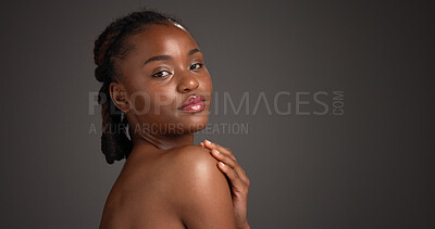 Buy stock photo Shoulder, skincare and portrait of black woman in studio for hydration, self care and dermatology. Mockup space, dark background and person with natural beauty, wellness and aesthetic for skin glow
