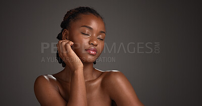 Buy stock photo Black woman, skincare and beauty with glow in studio for cosmetics on a dark background. Female person, model or relax with makeup, shine or spa for skin treatment or cosmetology on mockup space