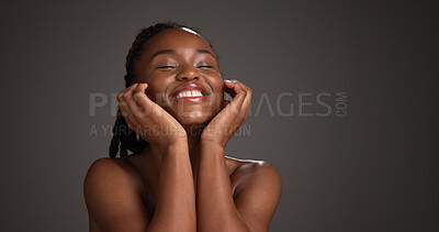 Buy stock photo Black woman, skincare and happy for touch in studio, natural glow or mockup space on dark background. African girl, beauty and smile with thinking, cosmetics or soft texture with dermatology benefits