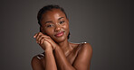 Skincare, happy and woman with glow, portrait and natural cosmetics for healthy skin or mockup space. Gray background, black person and self care with dermatology, confident and studio in Nigeria