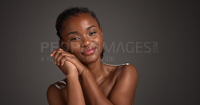 Buy stock photo Skincare, happy and woman with glow, portrait and natural cosmetics for healthy skin or mockup space. Gray background, black person and self care with dermatology, confident and studio in Nigeria
