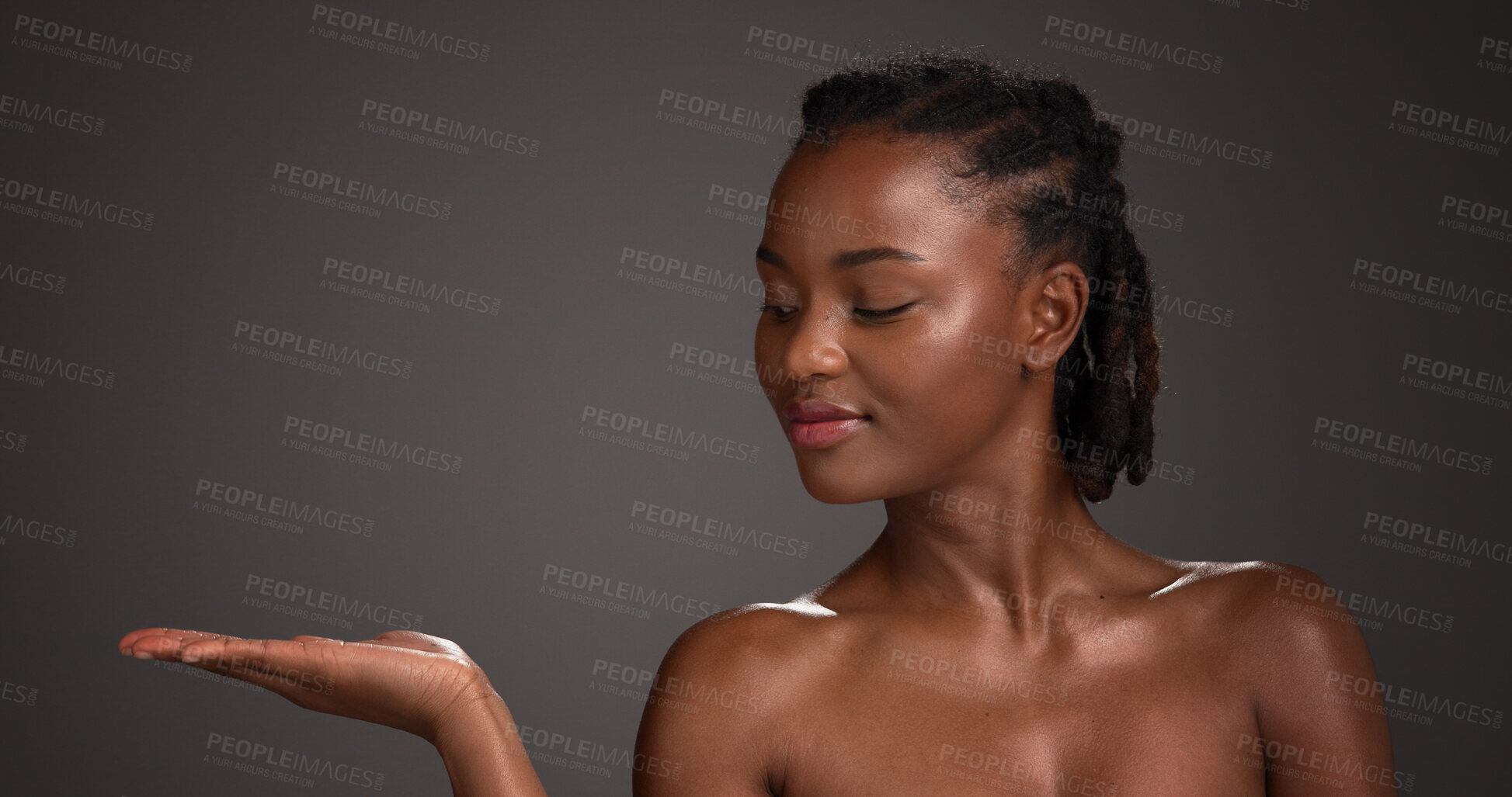 Buy stock photo Mockup space, skincare and black woman in studio for product placement, beauty and wellness. Advertising, salon and person with hands for dermatology review, healthy skin and glow on dark background