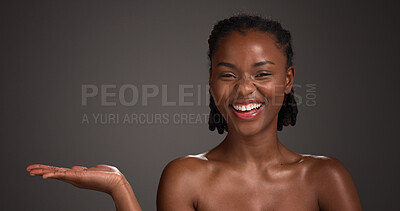 Buy stock photo Mockup space, skincare and portrait of black woman in studio for product placement, beauty or wellness. Advertising, spa and person with hands for dermatology, healthy skin or glow on dark background