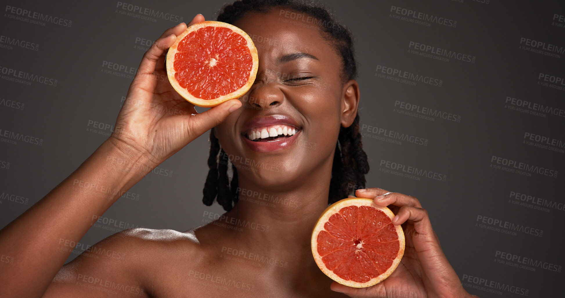 Buy stock photo Beauty, grapefruit and black woman in studio with natural, skincare or organic facial glow. Vitamin c, space and African female person with citrus fruit for dermatology hydration by gray background.