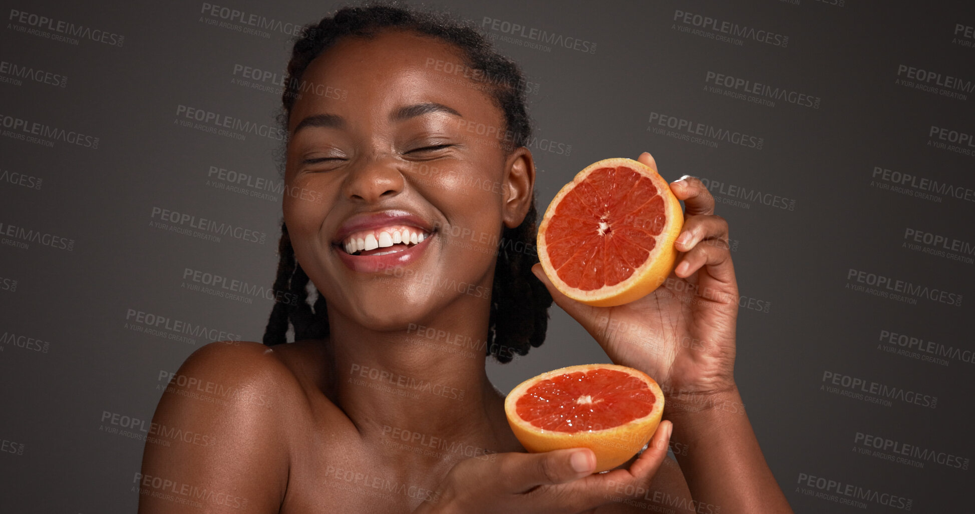 Buy stock photo Skincare, grapefruit and black woman in studio with health, natural or organic facial glow. Vitamin c, space and African female person with citrus fruit for dermatology hydration by gray background.