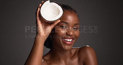 Buy stock photo Skincare, coconut and portrait of black woman in studio with natural, health and organic facial glow. Happy, space and African person with fruit for face hydration with dermatology by gray background